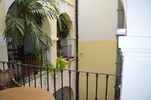 a balcony with a table and some plants at Hotel Meson del Mar in Veracruz
