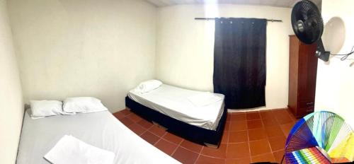En eller flere senge i et værelse på Bonito - La Maria