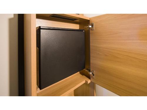 a wooden door with a black screen on it at GRIDS Premium Hotel Otaru - Vacation STAY 68539v in Otaru