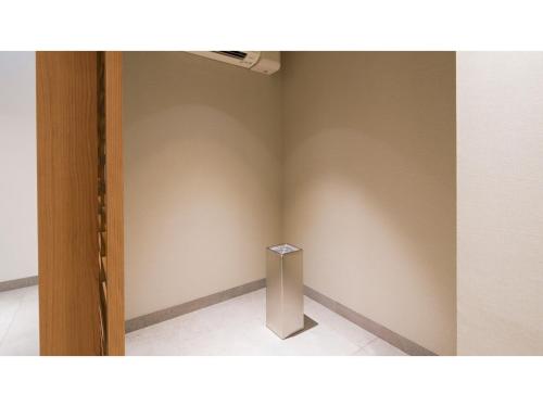a corner of a room with a wall with a pillar at GRIDS Premium Hotel Otaru - Vacation STAY 68539v in Otaru