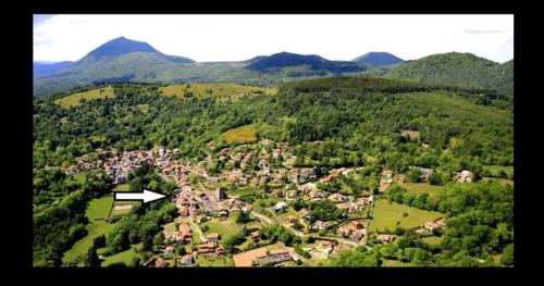 an aerial view of a village in the mountains at Volca'séjour in Orcines