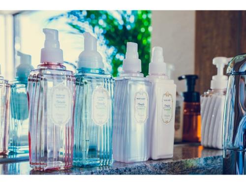 a group of bottles sitting on top of a counter at Hotel Grand View Takasaki - Vacation STAY 55422v in Takasaki
