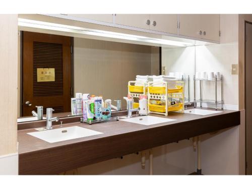 a bathroom counter with two sinks and a large mirror at Business Hotel Katsuya - Vacation STAY 62197v in Wakayama
