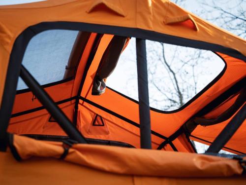a view of the inside of an orange tent at Tentbox Lite 2.0 in Thorpe le Soken