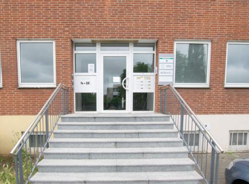 a set of stairs leading up to a building at T&K Apartments 6 and 10 Room Apartment in Neuss for big Groups 22min to Fair DUS in Neuss