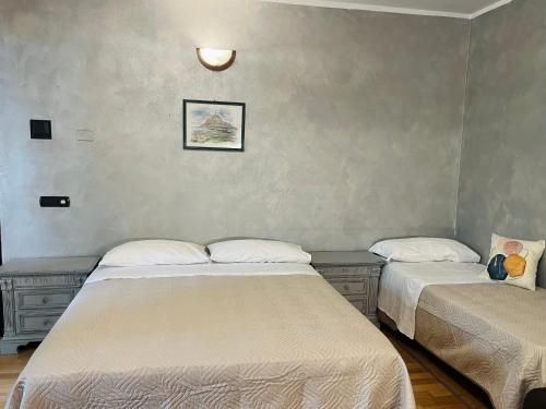 Ένα ή περισσότερα κρεβάτια σε δωμάτιο στο B&B LE AMARENE