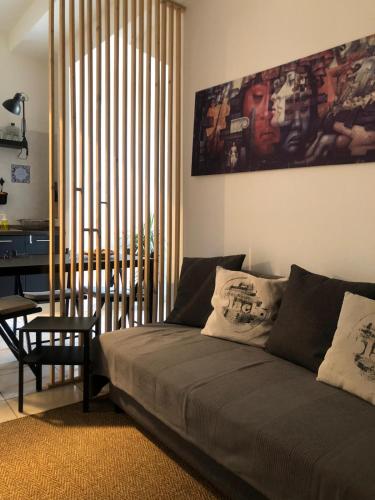 a living room with a couch and a table at Marina Design Apartment in Marina di Ragusa