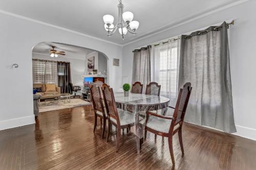a dining room with a table and chairs at Renovated Main Floor Large 3 Bed House in Buffalo