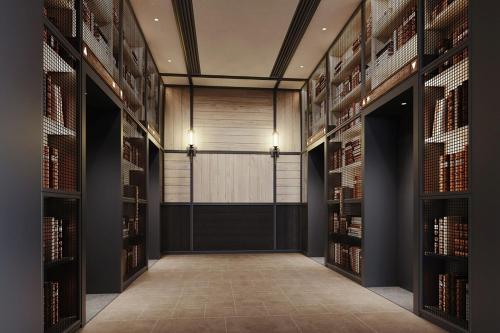 a library with bookshelves and a door in the middle at Four Points by Sheraton Nantong, Haimen in Nantong