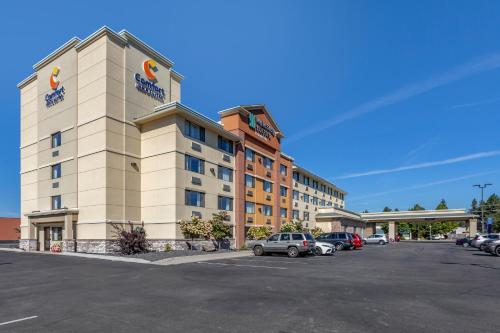 a hotel with a parking lot in front of it at Comfort Inn & Suites Coeur d'Alene in Coeur d'Alene