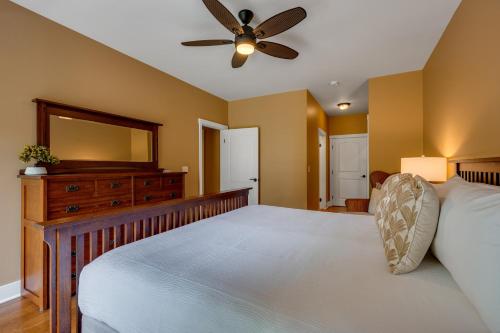 a bedroom with a large bed and a ceiling fan at Tropical Oasis at Regency at Poipu Kai 514 in Koloa