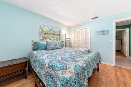 En eller flere senge i et værelse på Charming Beach Villa B