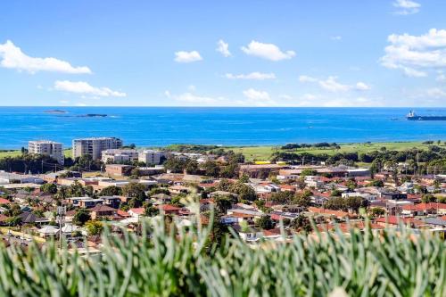 a view of a town with the ocean in the background at 'Wollongong Inner-city Escape' Bright Urban Oasis in Wollongong