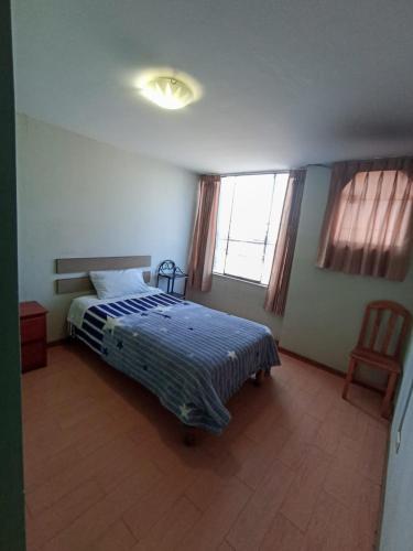 A bed or beds in a room at Hostal Los Andes, Cerro Colorado , Arequipa