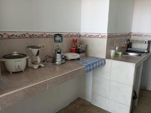 a kitchen with a counter with a blender on it at Departamento frente al mar in Playas