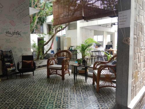 a room with chairs and tables in a store at Villa Papillon in Phnom Penh