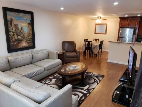 a living room with a couch and a table at Beautiful Spacious 2 Bedroom, 2 Bathroom Condo in Long Beach