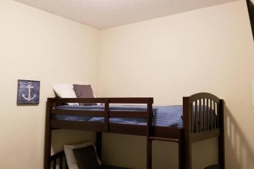 a bedroom with two bunk beds in a room at McDrifty's Hideaway in Panama City Beach