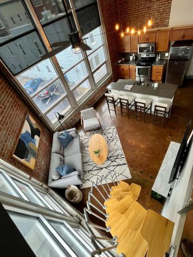 an overhead view of a kitchen and a living room at Exceptional 1 Br Apartment Downtown W Study Loft in Roanoke