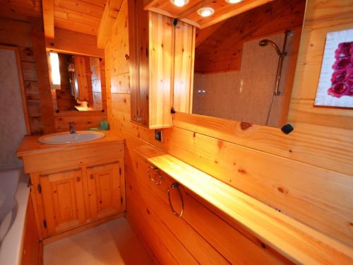 a wooden bathroom with a sink and a shower at Chalet Les Gets, 5 pièces, 9 personnes - FR-1-623-51 in Les Gets