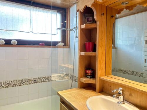 a bathroom with a sink and a shower at Appartement Les Gets, 2 pièces, 4 personnes - FR-1-623-256 in Les Gets