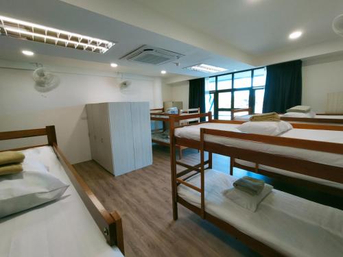 Postel nebo postele na pokoji v ubytování Agape Hostel