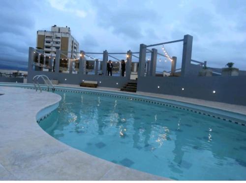 a swimming pool on the roof of a building at Temporarios NYC2 - Centro CBA in Cordoba