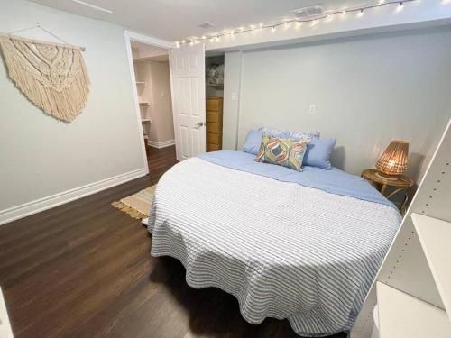 a bedroom with a large bed in a room at Spacious & Renovated 1BD Suite w/parking in Toronto
