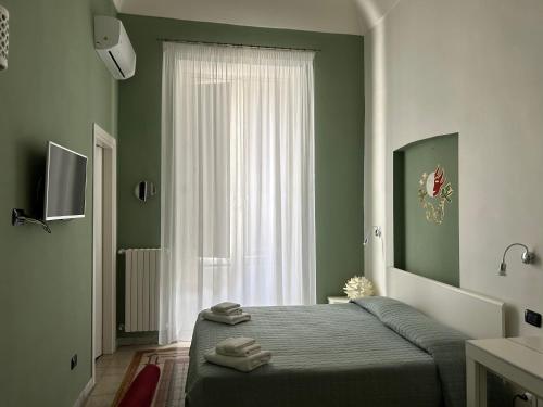 Ένα ή περισσότερα κρεβάτια σε δωμάτιο στο La Dimora dell' Architetto