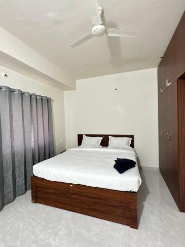 Voodi või voodid majutusasutuse SanTrupthi - A 3bhk Stay at Home toas