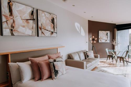 a bedroom with a bed and a living room at Eagle View Escape in Rydal