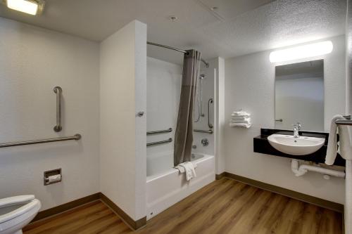 a bathroom with a sink and a shower and a toilet at Motel 6-Ogden, UT - Riverdale in Ogden