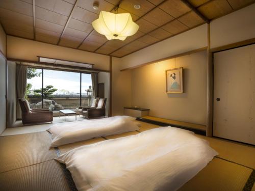 Katil atau katil-katil dalam bilik di Hotel Yagi