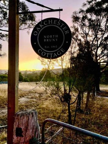 a sign for a coffee shop in a field at Oakchester Cottage on Bruny Island in Killora