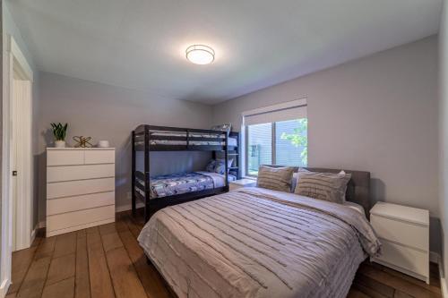 a bedroom with a bunk bed and a window at #521- Luxury Remodeled, Mid-Town Condo in Mammoth Lakes