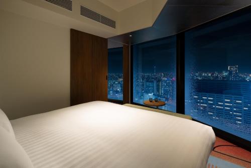 Un ou plusieurs lits dans un hébergement de l'établissement HOTEL GROOVE SHINJUKU, A PARKROYAL Hotel