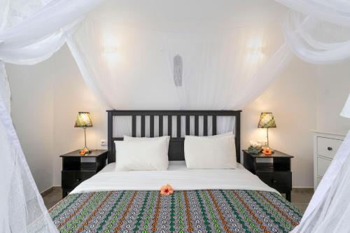 Postel nebo postele na pokoji v ubytování White Paradise Zanzibar