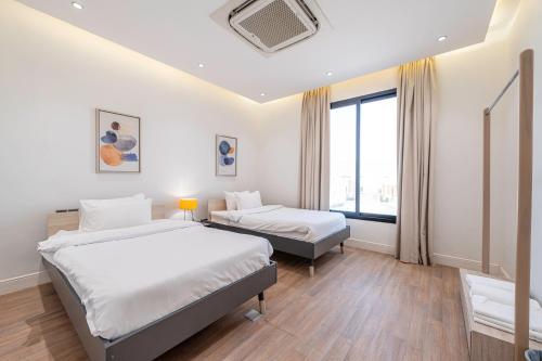 Krevet ili kreveti u jedinici u okviru objekta Mabaat-Superior-Al Qairawan-2BR-54