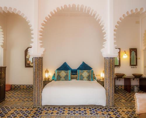 Postel nebo postele na pokoji v ubytování Hotel Blanco Riad