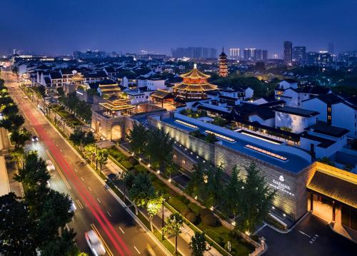 an aerial view of a city at night at Pan Pacific Suzhou in Suzhou