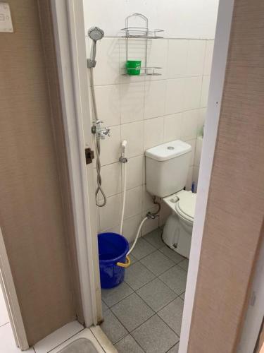 a bathroom with a shower and a toilet at RrProperty in Jakarta