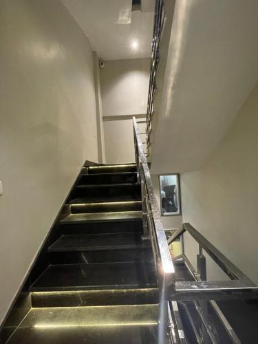 an empty staircase in a building with escalators at Vishwanath Inn in Varanasi