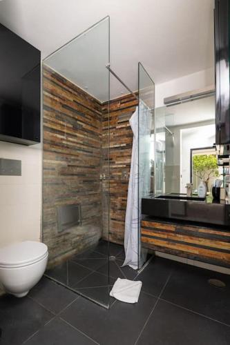 a bathroom with a glass shower and a toilet at Lemon House, Capri in Capri