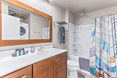 a bathroom with a sink and a toilet and a shower at Spacious 2 King Bed Downtown Central to it All in Ann Arbor