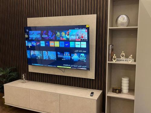 a flat screen tv on a wall in a living room at Luxury residences in Khamis Mushayt