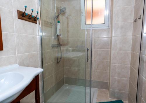a bathroom with a shower and a sink at Casa Laguna in Costa Calma