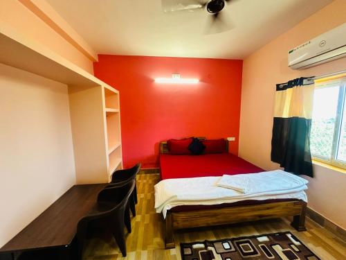 Cama ou camas em um quarto em Mangalam guest house