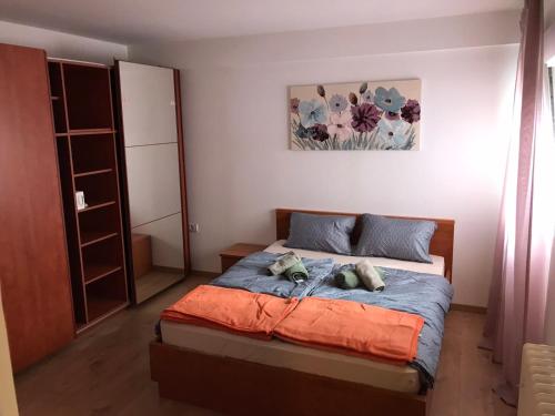 a bedroom with a bed with two pillows on it at Apartman Luka in Slavonski Brod