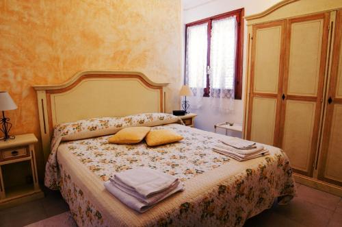 Кровать или кровати в номере Il Melograno
