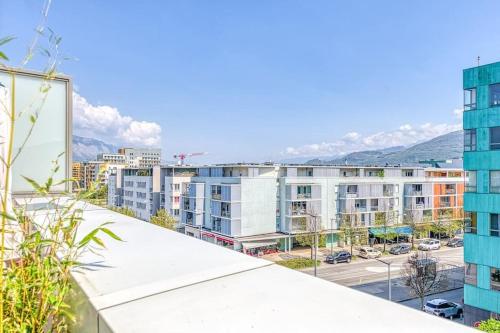 a view of a city from a building at Standing, balcon avec vue, clim, tt équipé confort in Échirolles